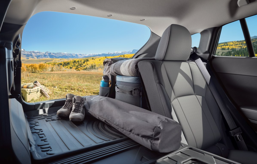 Subaru interior cargo space with rear seats folded flat for camping and adventure gear
