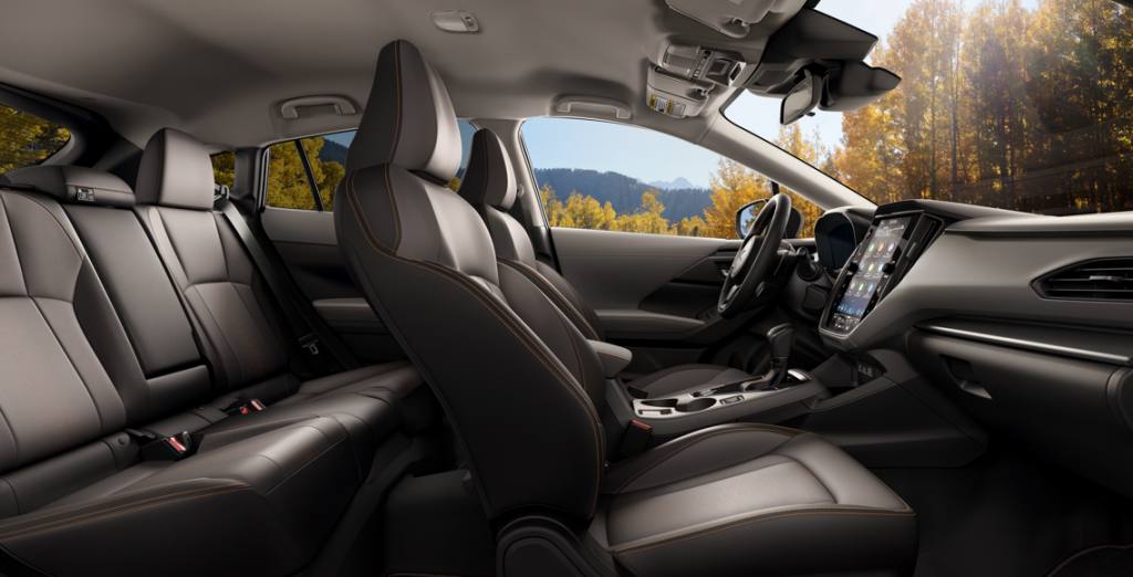 2026 Subaru Crosstrek interior with comfortable front and rear seating, modern dashboard, and touchscreen display