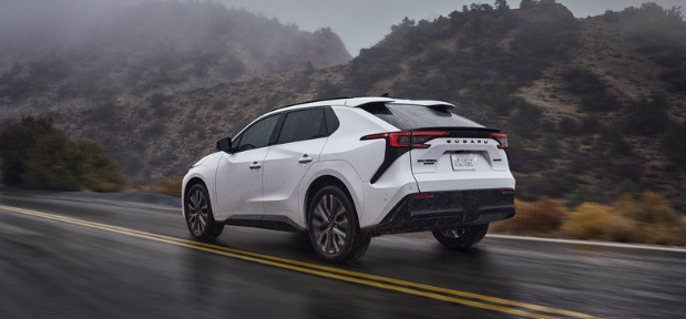 Action shot of 2026 Solterra driving down paved road