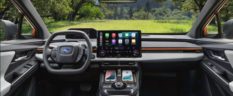 Interior major of the dashboard, steering wheel, multimedia touchscreen, wireless charging pads and gear shift of the 2026 Uncharted GT trim with Gray StarTex upholstery. Interior major of the dashboard