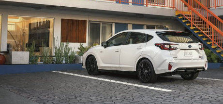 Unlimited Impreza RS parked in front of boutique hotel