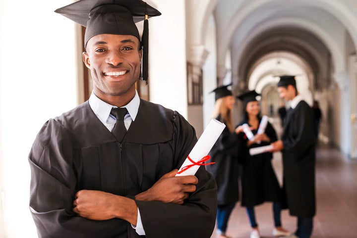 college graduate holding his diploma | All American Subaru of Old Bridge in Old Bridge NJ
